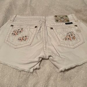 White distressed shorts